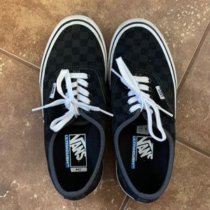 Black and grey checkered vans men’s size 7.5 women’s size 9.5